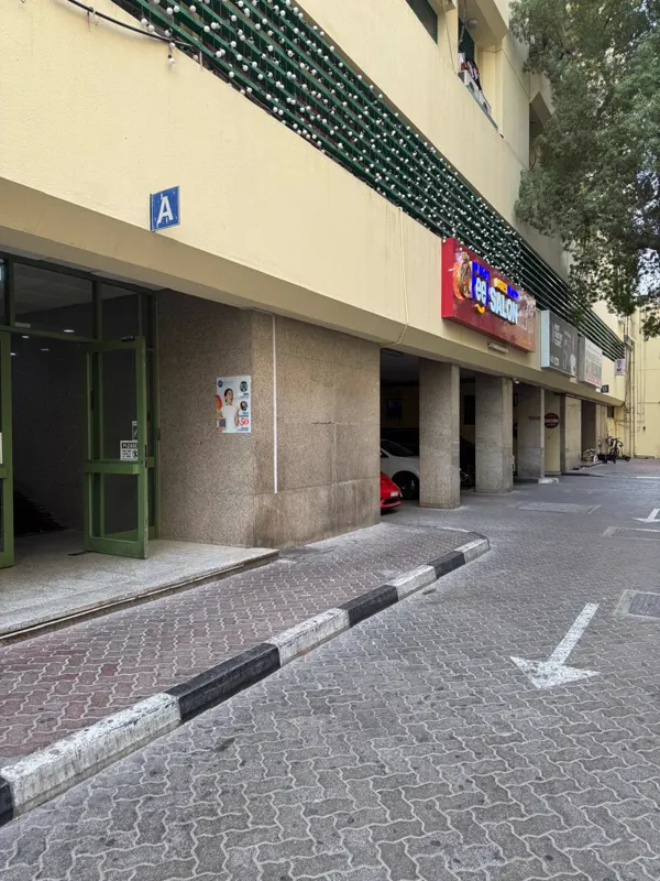 Block A entrance door with the blue A sign on the Al Owais Building